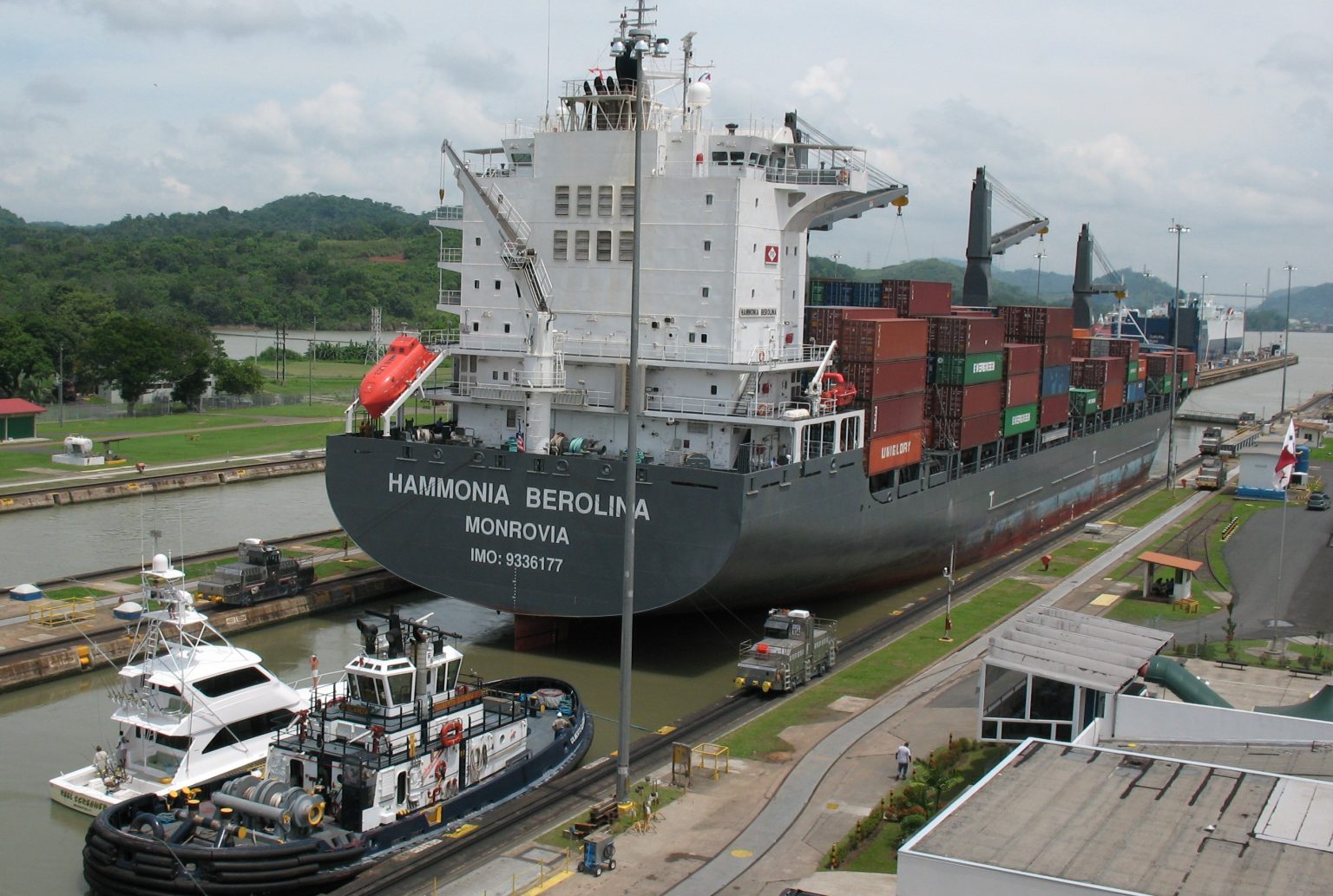 Panama Canal transit with a container ship entering the Miraflores Locks