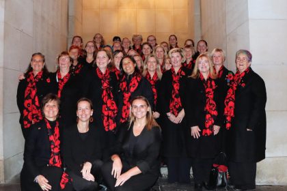 Members of the Belgium Military Wives Choir performing during a remembrance ceremony in Belgium in 2026
