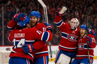 Montreal Canadiens erupt in celebration after stunning comeback performance.