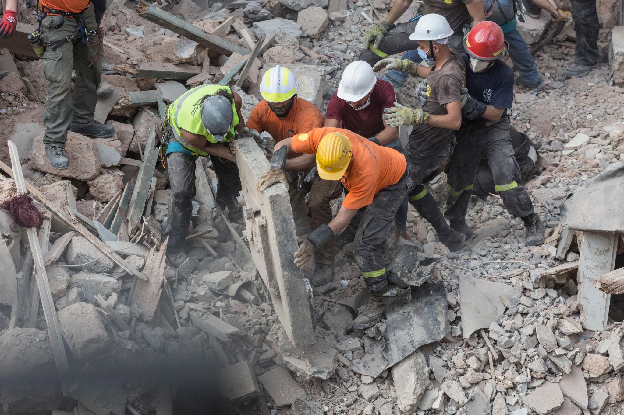 Lebanon civilian casualties Beirut destruction smoke buildings