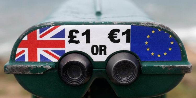 FILE PHOTO: Tourist binoculars offer users the chance to pay in Pounds or Euros in the British overseas territory of Gibraltar, historically claimed by Spain, April 20, 2017. REUTERS/Phil Noble