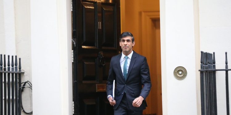 British Chancellor Rishi Sunak leaves 11 Downing Street ahead of unveiling spending review.
