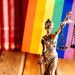 Statue of Justice - symbol of law and justice with lgbt flag. Lgbt rights and law