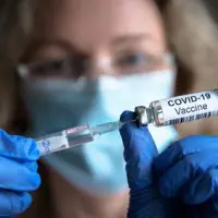 Covid-19,Vaccine,In,Researcher,Hands,,Female,Doctor,Holds,Syringe,And