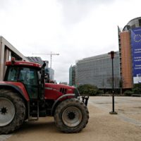 Tractors,Are,Seen,Outside,Of,Eu,Commission,Headquarters,As,Farmers