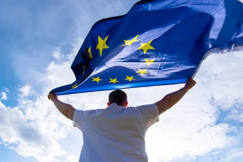 Man,Holding,Eu,Flag,Or,European,Union,Flag,,Concept,Picture