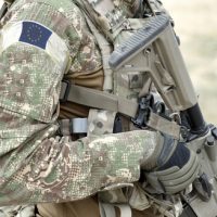 Soldier,With,Assault,Rifle,And,Flag,Of,Europe,On,Military