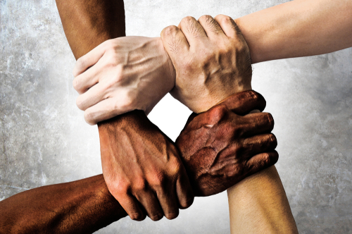 Multiracial,Group,With,Black,African,American,Caucasian,And,Asian,Hands