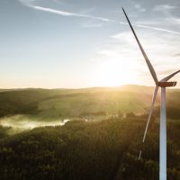 Wind,Turbine,In,The,Sunset,Seen,From,An,Aerial,View