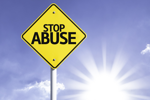 Stop,Abuse,Road,Sign,With,Sun,Background