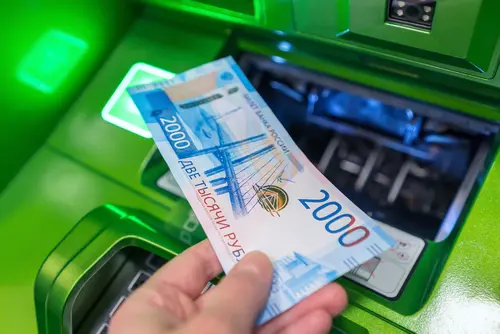 Man's,Hand,Holds,New,Russian,Banknote,Of,Two,Thousand,Rubles