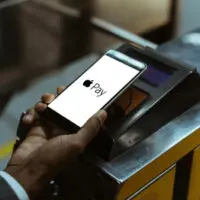 Close-up,View,Of,Man,Using,Apple,Pay,Paying,For,Public