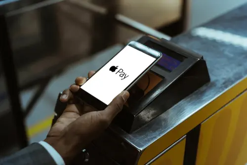 Close-up,View,Of,Man,Using,Apple,Pay,Paying,For,Public