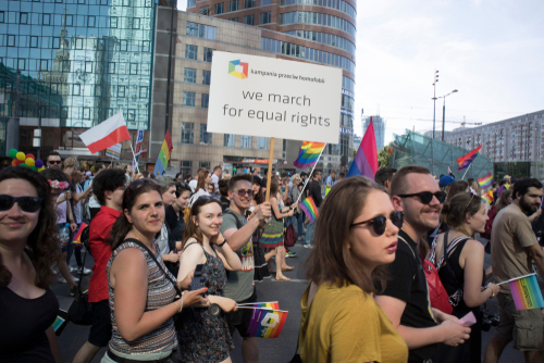 Warsaw, Poland - June 9, 2018: Participants of large Equality Parade - LGBT community pride parade in Warsaw city. Placard "We march for equal rights