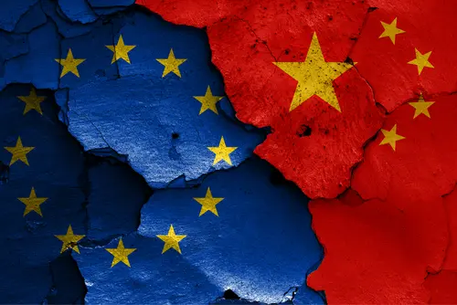 Flags,Of,Eu,And,China,Painted,On,Cracked,Wall