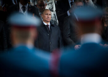 Belgrade, Serbia - October 16, 2014: Russian President seen through the soldiers during the military parade March of the victorious in Belgrade. President Vladimir Putin of Russia arrived in Belgrade