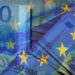 Waving,Eu,Flag,On,A,Euro,Money,-,Background