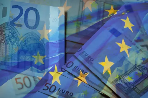 Waving,Eu,Flag,On,A,Euro,Money,-,Background