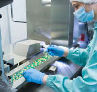 Pharmaceutical,Industry,Man,Worker,In,Protective,Clothing,Operating,Production,Of