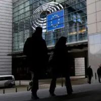 People,Walk,Outside,Of,The,European,Parliament,In,Brussels,,Belgium