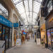 Reims, France - March 2021 - The covered passageway of Subé-Talleyrand, which consists in a shopping street in downtown covered with a glass awning, and bordered by various small local businesses