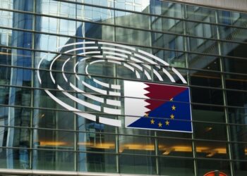 Qatargate - Qatar and european eunion flags in fron of the eu parliament in Brussels