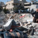 GAZA, PALESTINIAN TERRITORY - DECEMBER 3: A man combs amid the rubble of the Palestinian National Authority Council of Ministers building, December 3, 2012.