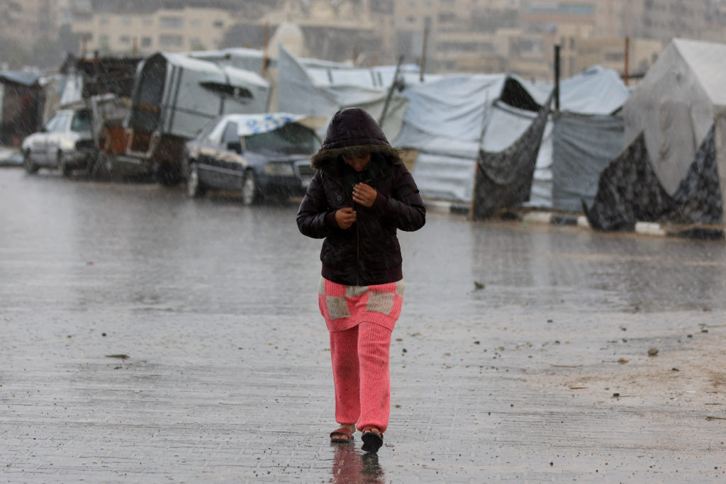 Gaza civilians winter storms flood makeshift tents
