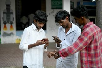 Indian Gen Z voters using smartphones to follow India election updates