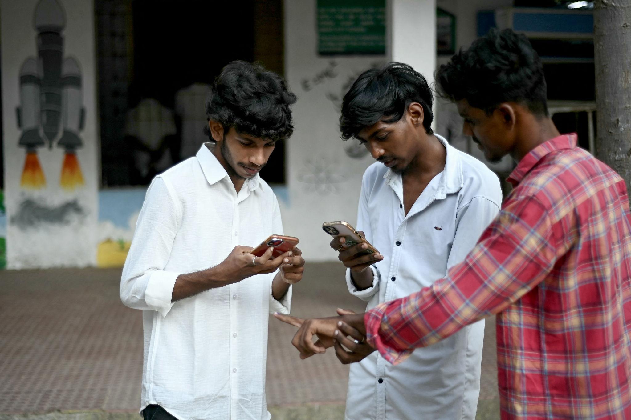 Indian Gen Z voters using smartphones to follow India election updates
