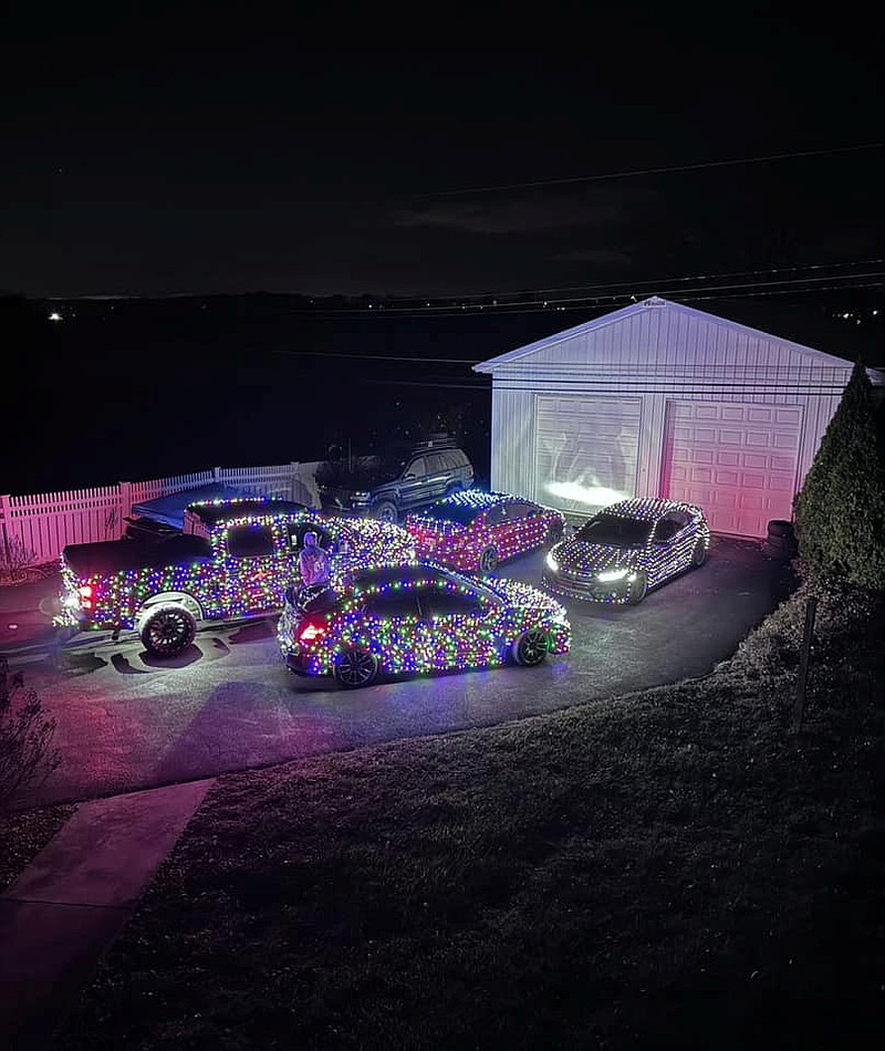 Santa speeding Ohio standing beside a police car with flashing lights