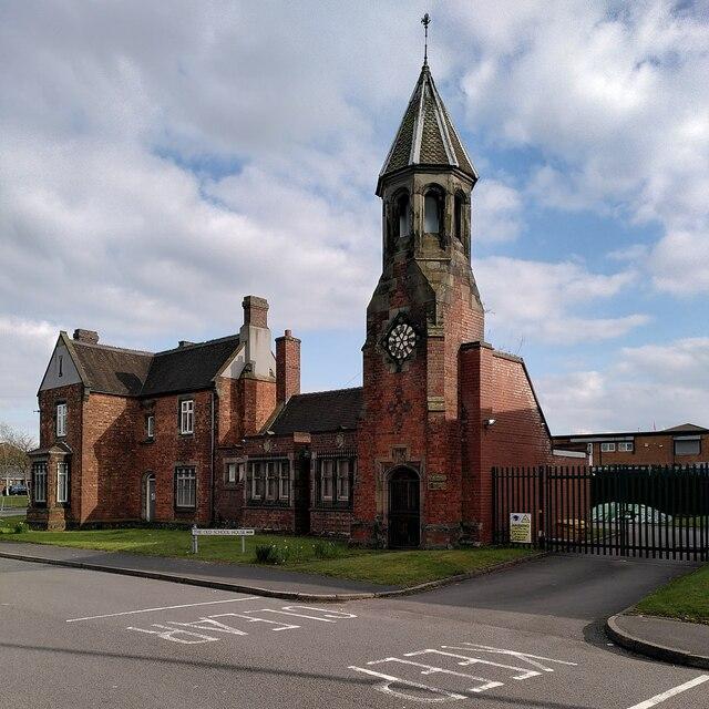 European Schools employment dispute illustrated by a historic school building.