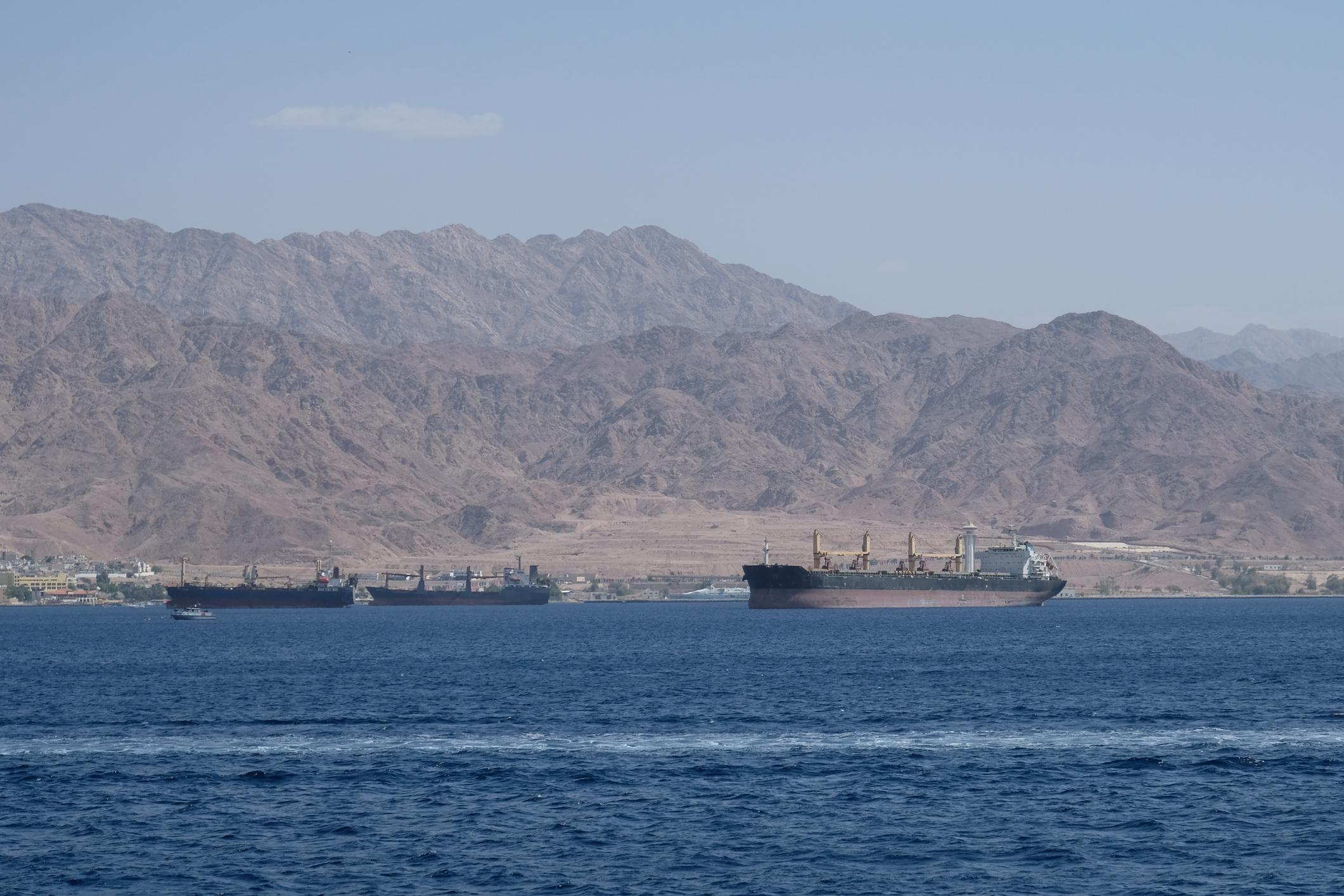 Oil tanker passing through Strait of Hormuz highlighting global oil supply stability concerns