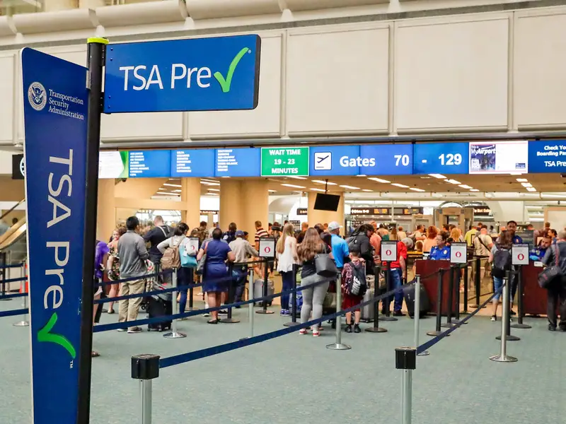 US travel policy biometric screening technology at airport checkpoint