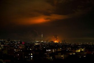 Tehran skyline during Iran civilian infrastructure attacks crisis 2026