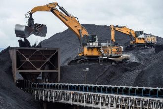 Heavy mining equipment operating at a Coal India mine as part of sustainable coal mining modernization efforts