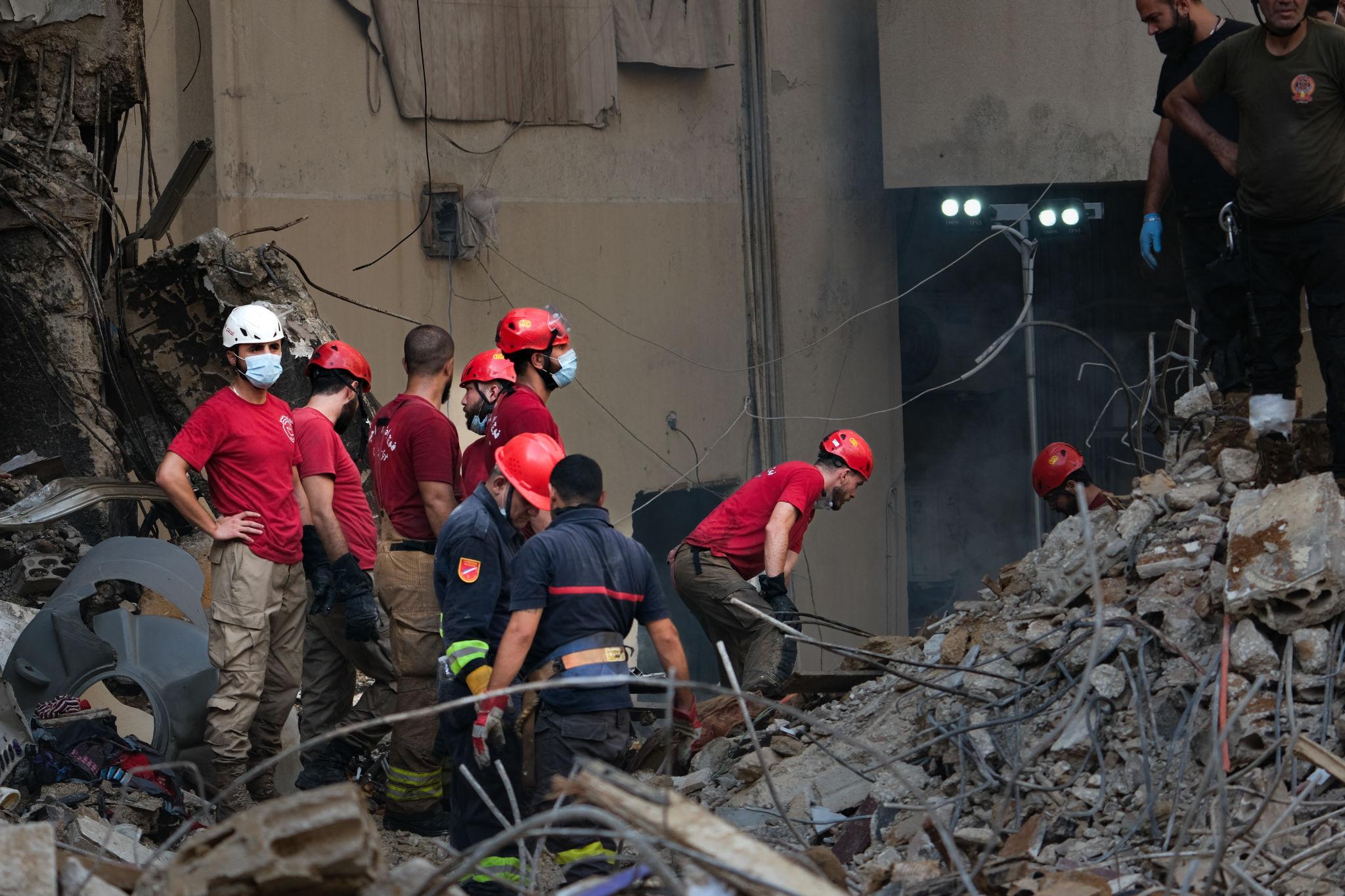 Middle East tensions update showing aftermath of strike in Lebanon with emergency responders