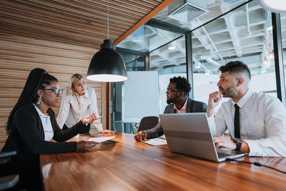 Corporate communications team developing a crisis response strategy to protect brand reputation