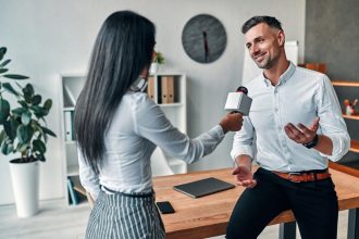 Professional journalist interviewing a company representative about media coverage benefits and business reputation