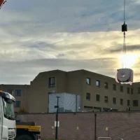 A new 8-ton MRI machine installed at Sint-Truiden Hospital with a 500-ton crane
