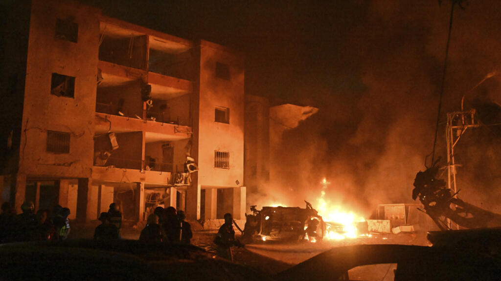 firefighters responding to Tehran residential attack apartment explosion