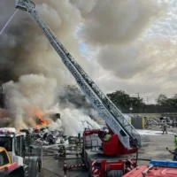 Anderlecht waste fire halts trains, burns large pile of trash