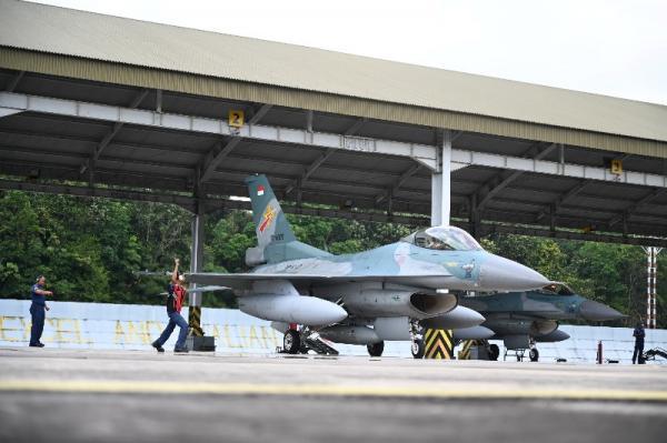 Government officials discussing Southeast Asia defence tensions in Jakarta