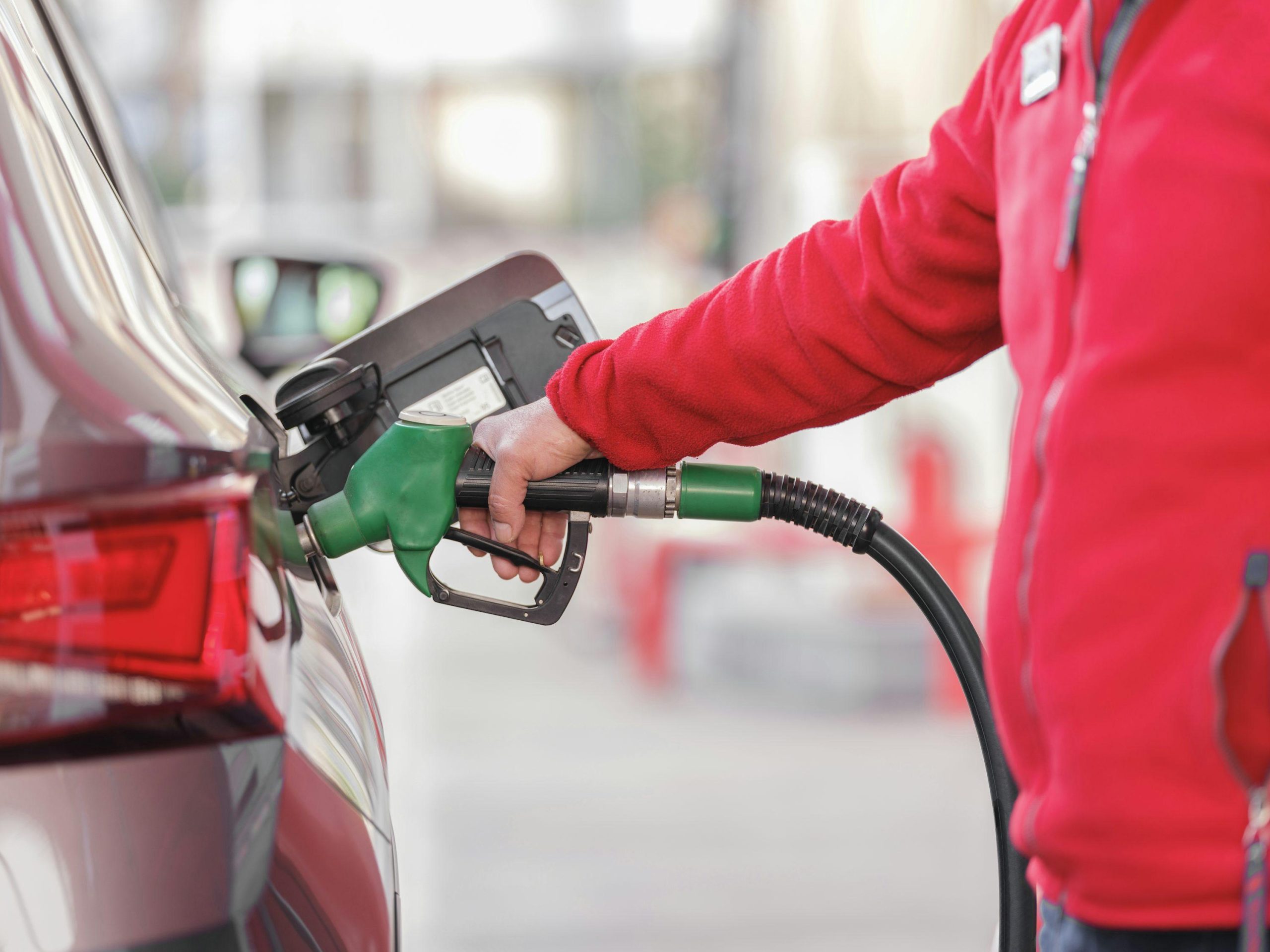 Motorist refuelling a vehicle as Belgium petrol and diesel prices remain elevated.