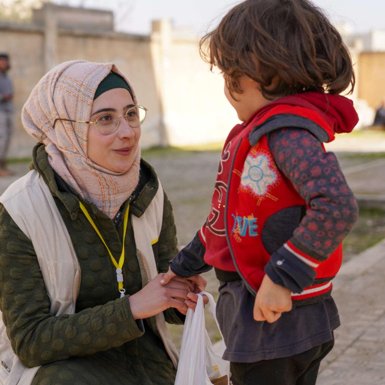 Aid workers responding to Middle East humanitarian tensions across conflict zones in 2026