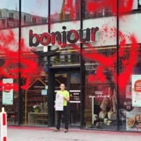 Brussels activist targets total energies HQ over EACOP protest