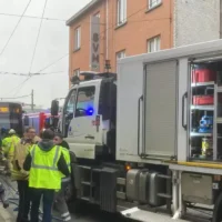 Child narrowly escapes serious injury under tram in Evere