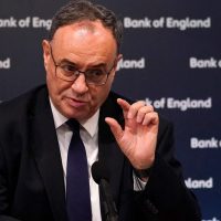 Policymakers discussing UK economy interest rates and inflation strategy