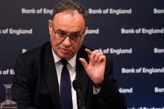 Policymakers discussing UK economy interest rates and inflation strategy