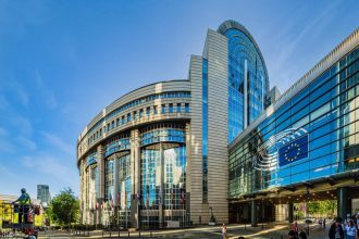 EU cancer funding debate raises concerns over research budgets at European Parliament in Brussels.